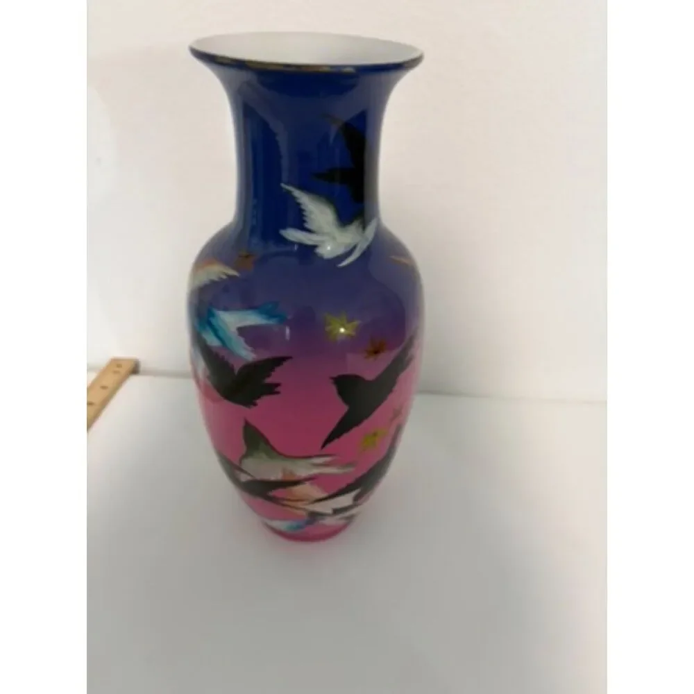 japanese vase with dark blue and pink ground, featuring birds